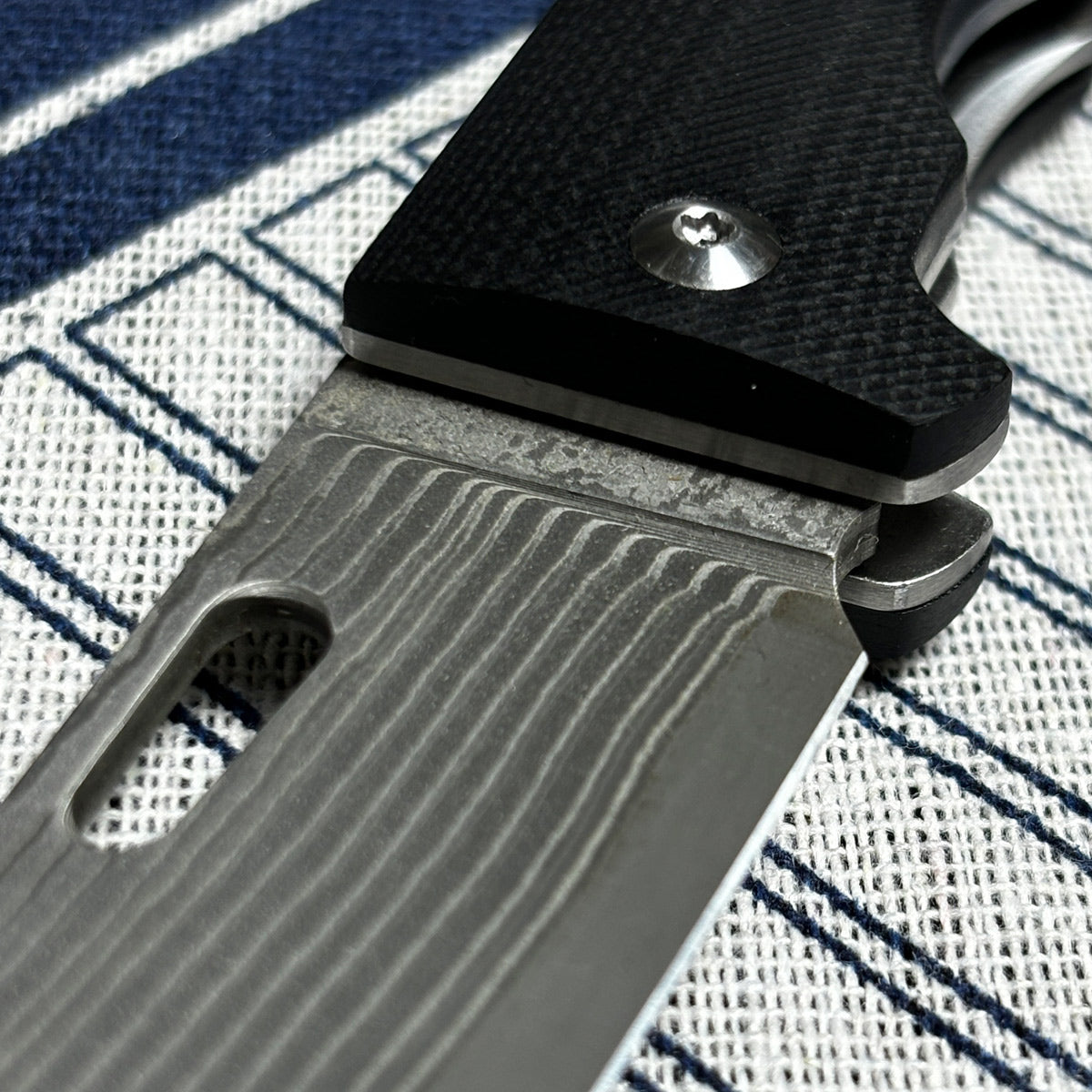 Japanese-origin Takeshi Saji Folding Knife: Damascus SG2 Powdered Steel, Handcrafted, G10 Handle.