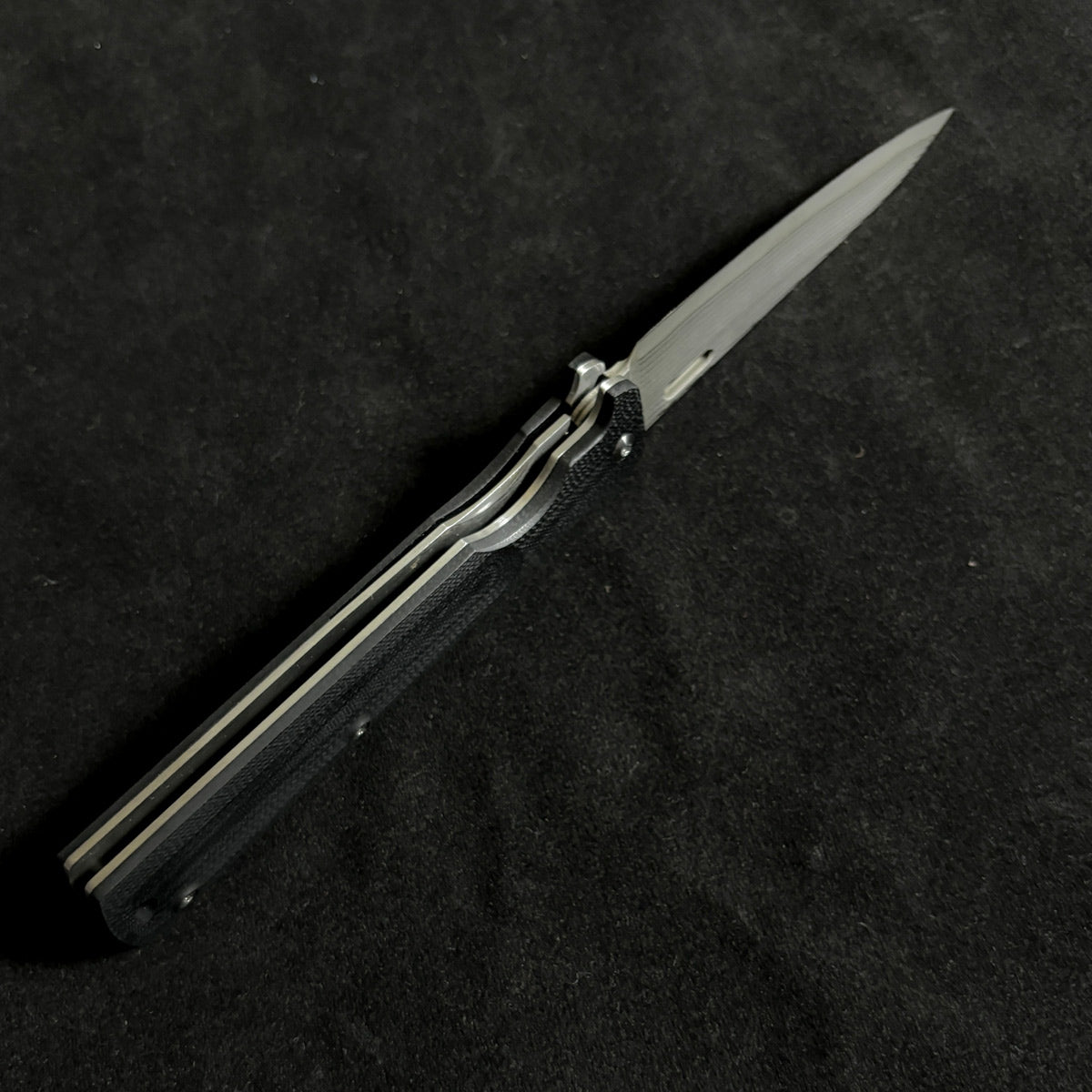 Japanese-origin Takeshi Saji Folding Knife: Damascus SG2 Powdered Steel, Handcrafted, G10 Handle.