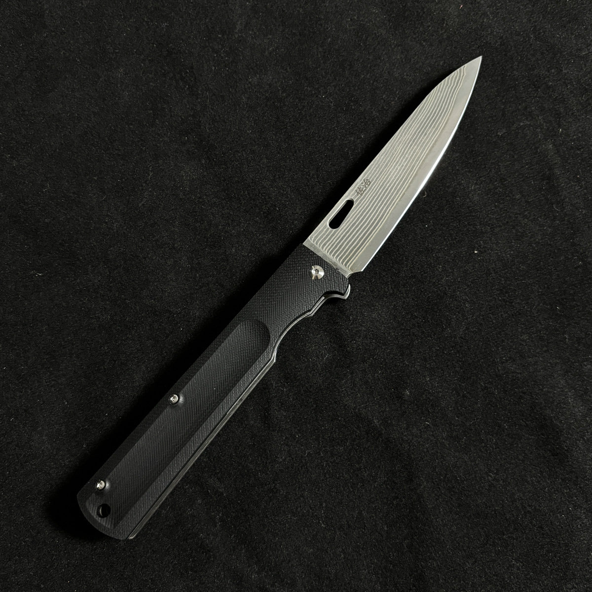 Japanese-origin Takeshi Saji Folding Knife: Damascus SG2 Powdered Steel, Handcrafted, G10 Handle.